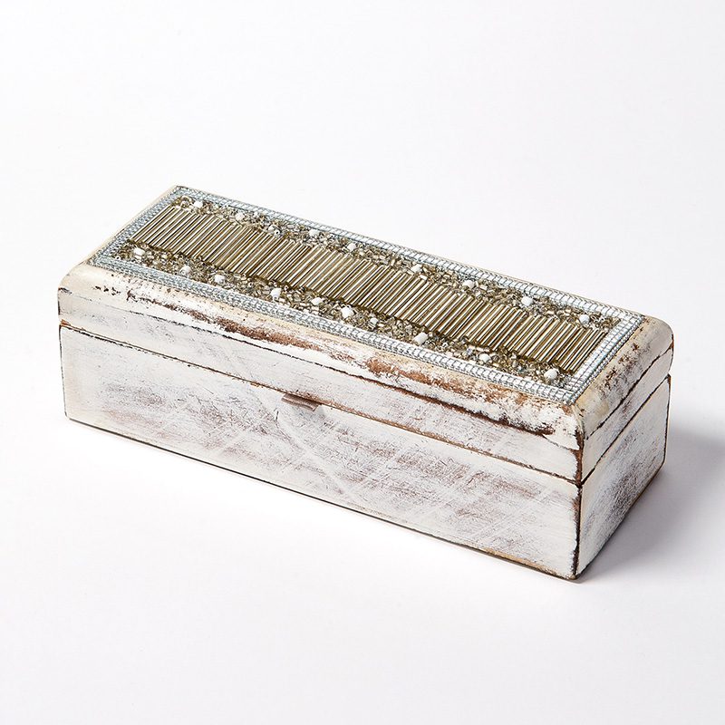 White wooden box with beads