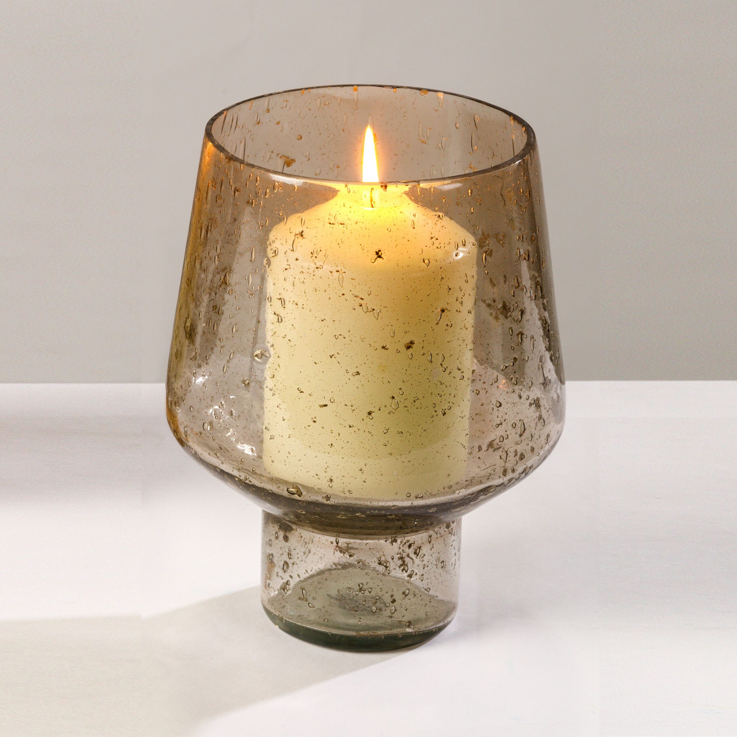 Pebbled finish smoke glass hurricane lamp.