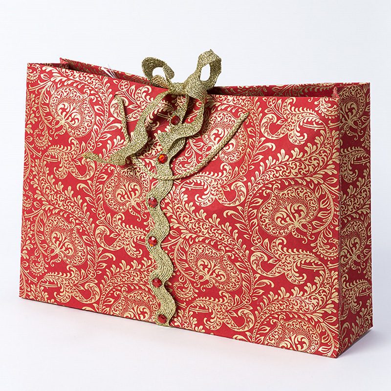 Handmade gift bags made from our handmade wrapping paper are perfect for all shapes and sizes of presents, and all occasions. Shown here in Red Splendour.