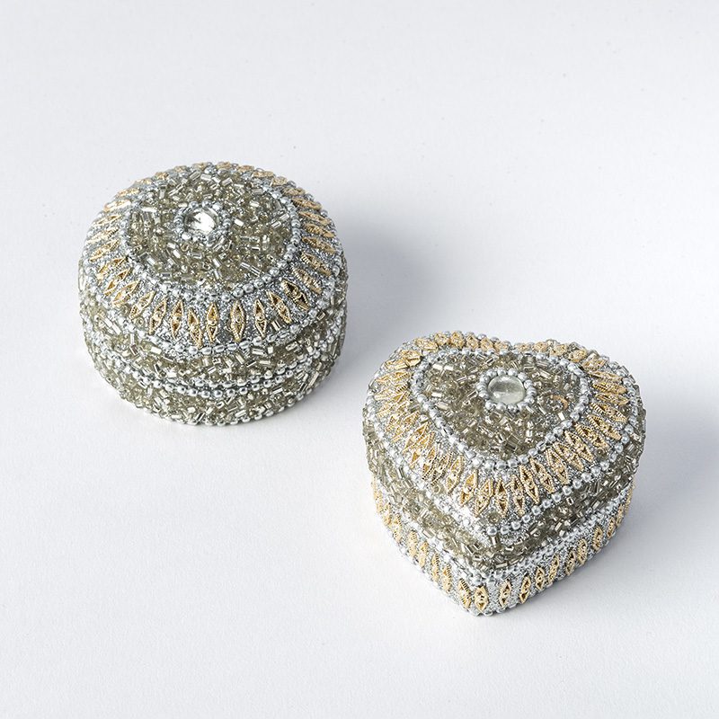 This elegant Trinket Box decorated with beads is attractive and irresistible. It is available in a round and a heart shape