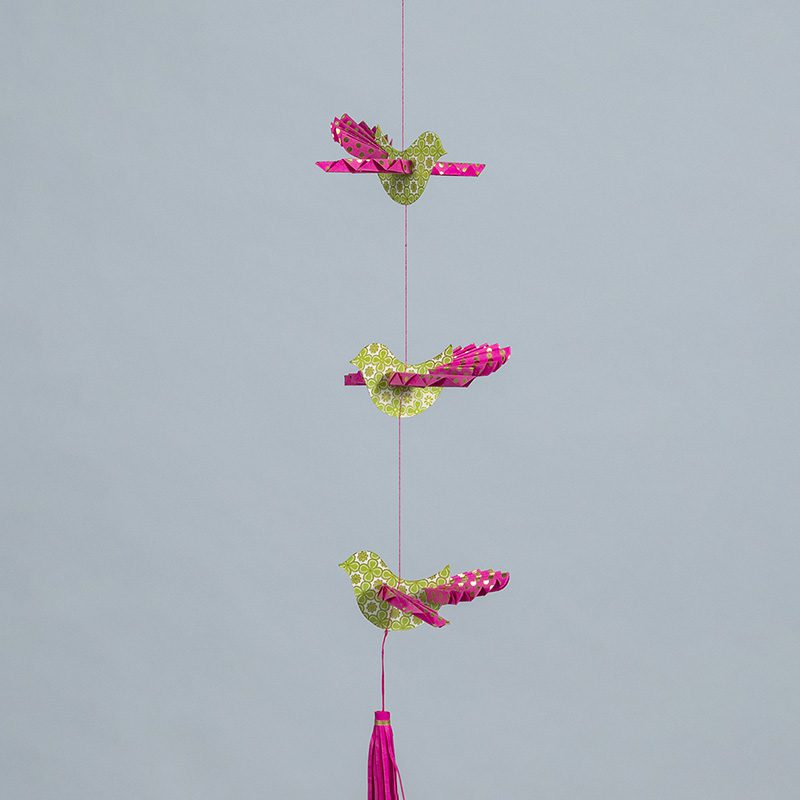 green and pink bird mobile
