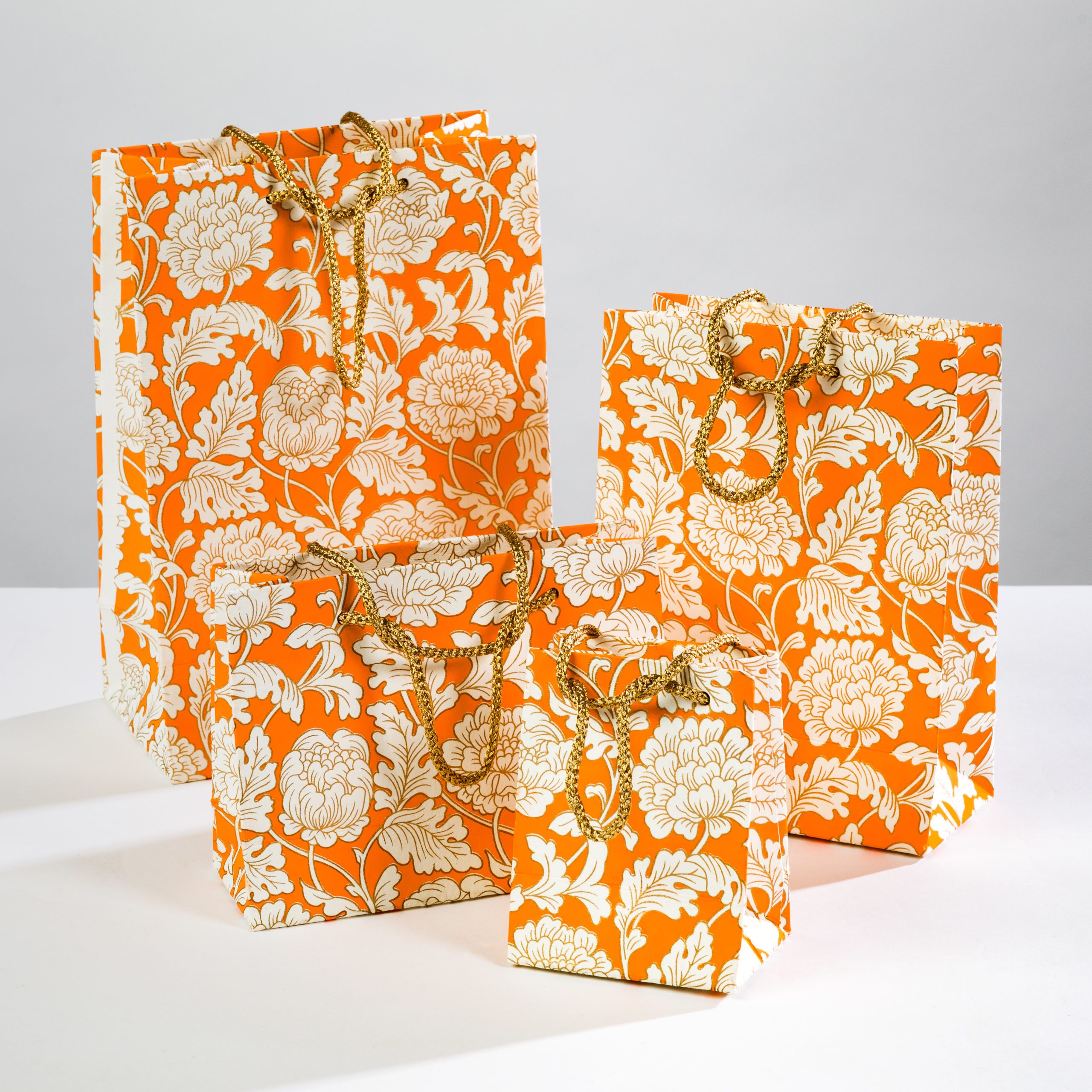 Orange Floral gift bags add a touch of elegance to any occassion.