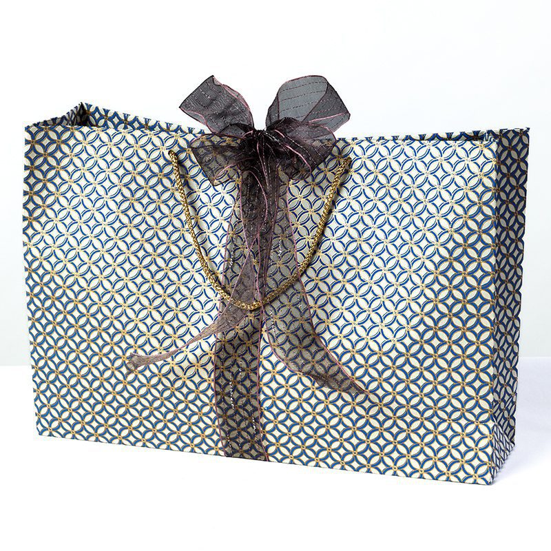 The trellis print gift bags with a contemporary design printed in rich colours of blue and gold are perfect for Christmas and an excellent design for men's gift bags.