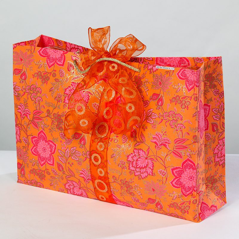 Orange floral print gift bags with all their detailing and their rich colour combination of hot pinks and gold is simply magical