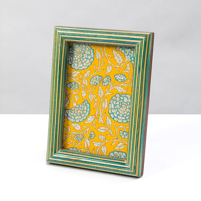 Our green and yellow stripes mango wood photo frame is vibrant and colourful.