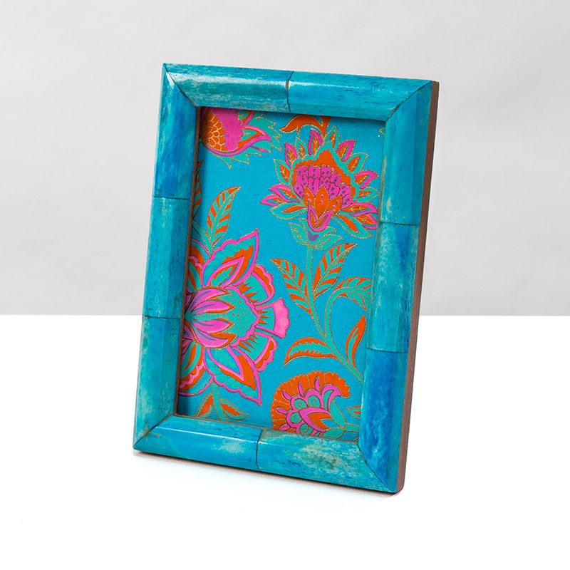 Our turquoise photo frame adds a splash of colour to your home.