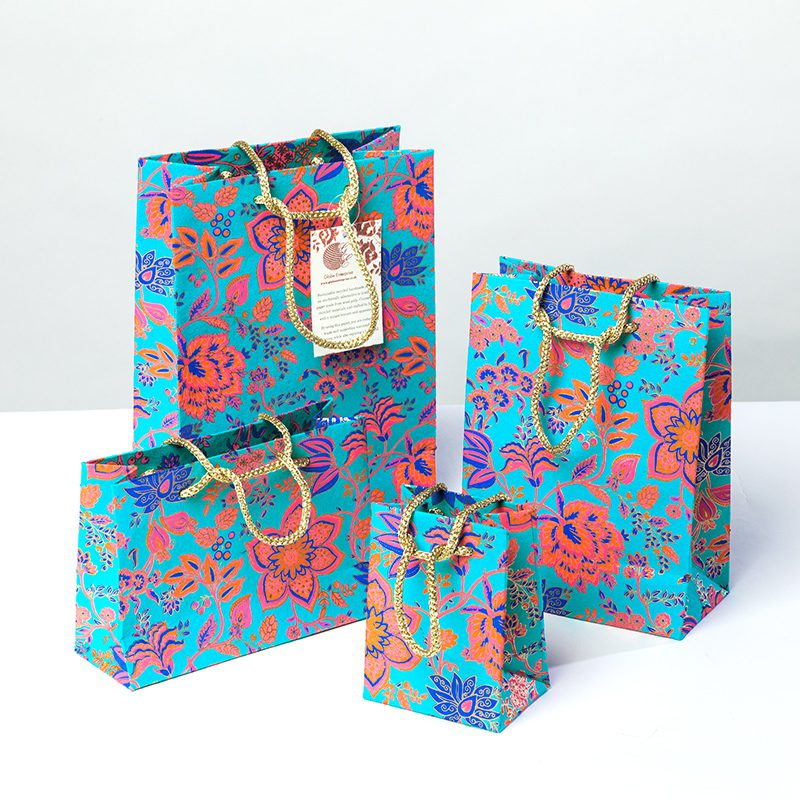 Turquoise Floral gift bag is colourful with vibrant floral print.