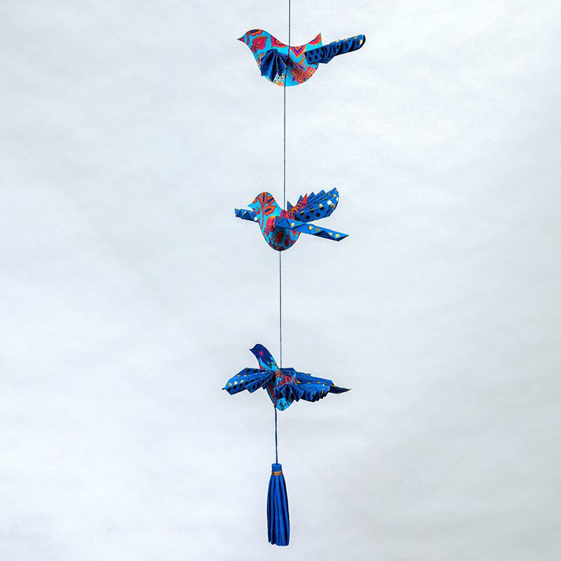 Turquoise floral bird mobile with origami wings is enchanting.